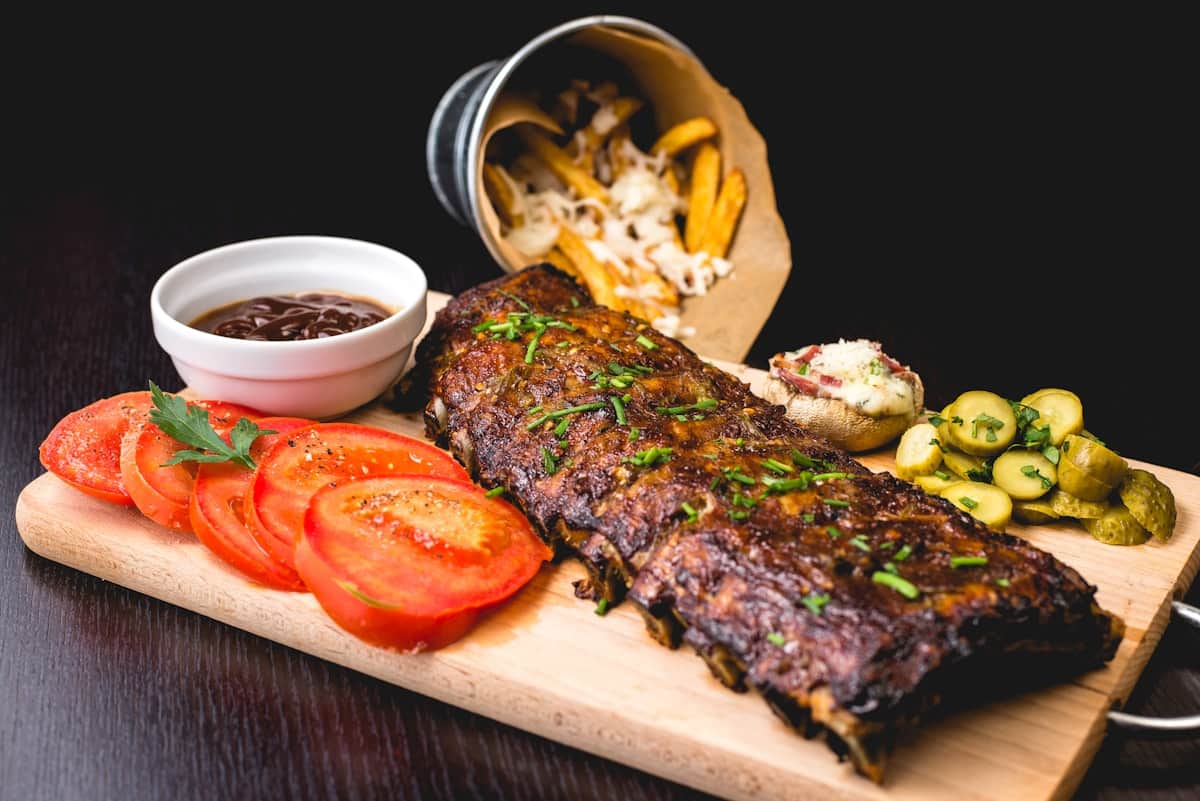 Flame-grilled food served with sides